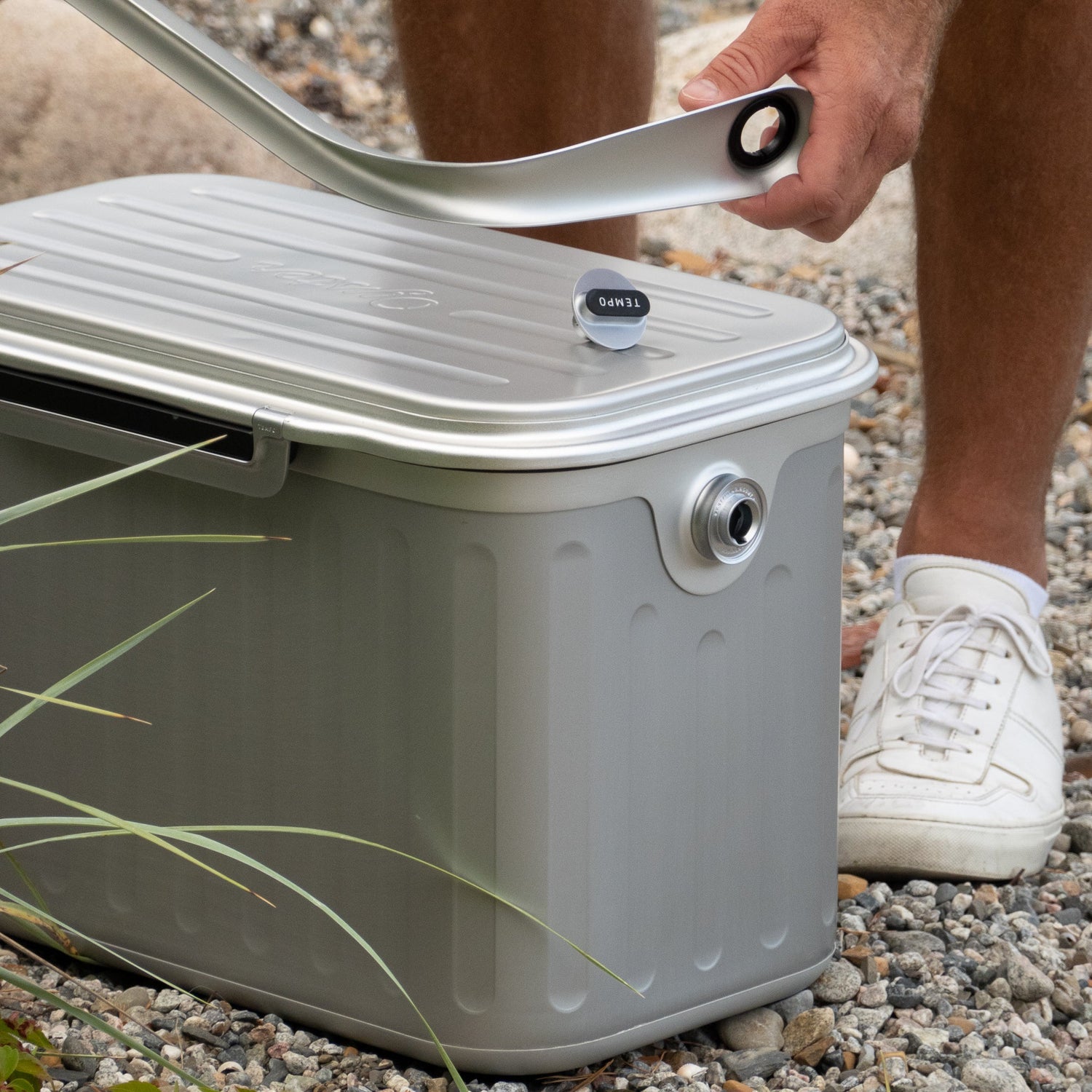 man carrying oyster cooler